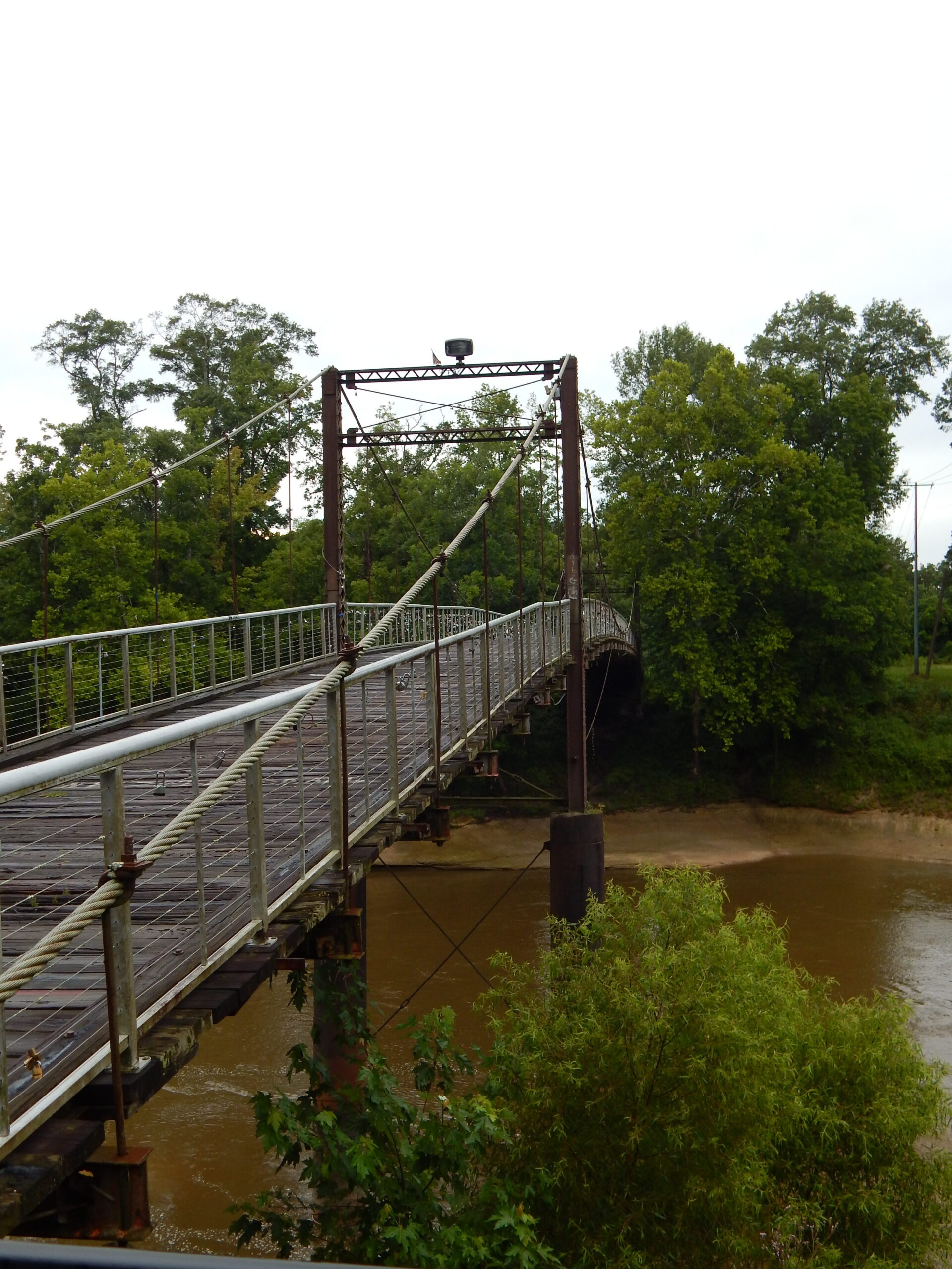 An old wooden bridge across a river
